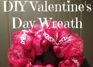 A beautiful, hot pink, large wreath made out of tulle and ribbon.